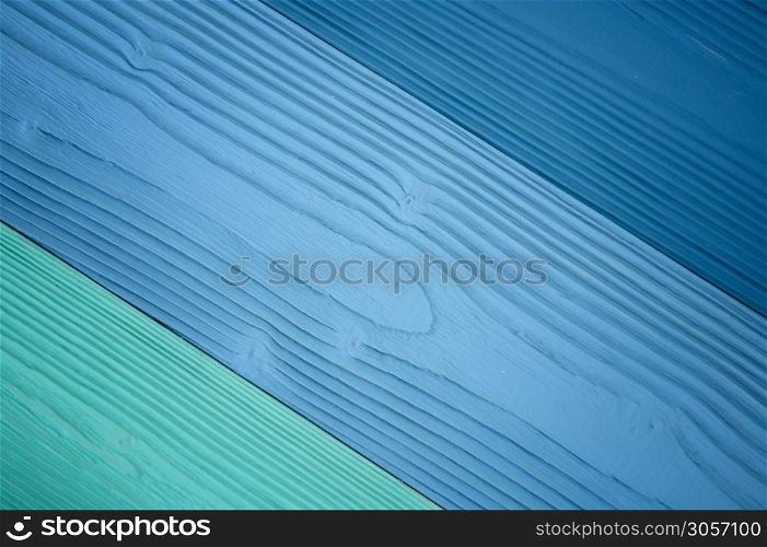 Top diagonal view of blue wooden textured background backdrop. Abstract wallpaper pastel blue ocean color