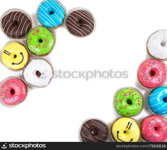 top frame from assorted glazed doughnuts in different colors on white background