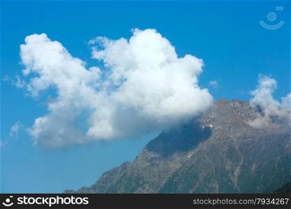 Top mountain summer view with cloud in sky