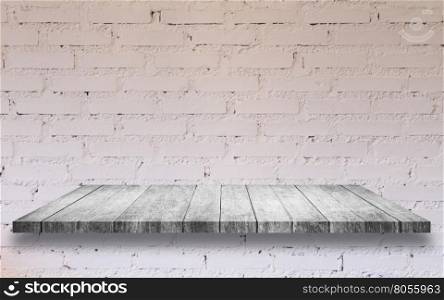 Top of black and white wooden shelf with white brick wall decorated in coffee shop