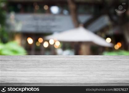 Top of black and white wooden table with cafe blurred abstract background