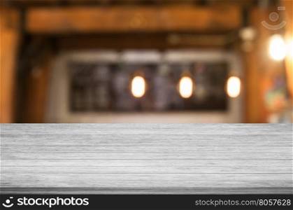Top of black and white wooden table with coffee shop blurred abstract background