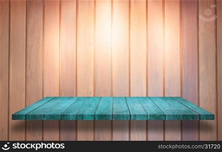 Top of blue wooden shelf with spot light on wooden wall background, stock photo
