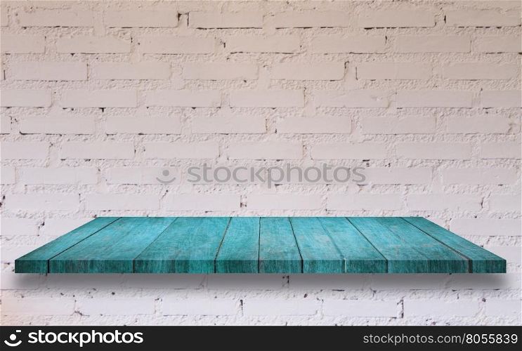 Top of blue wooden shelf with white brick wall decorated in coffee shop