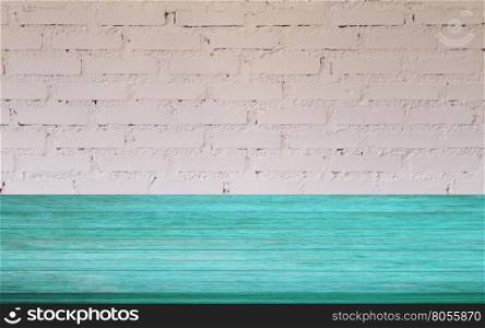 Top of blue wooden table with white brick wall decorated in coffee shop