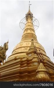 Top of golden stupa in buddhist monastery, Yangon, Myanmar