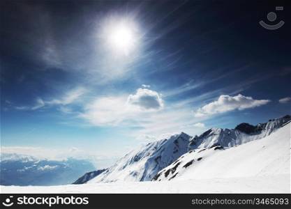 top of mountains in blue sky
