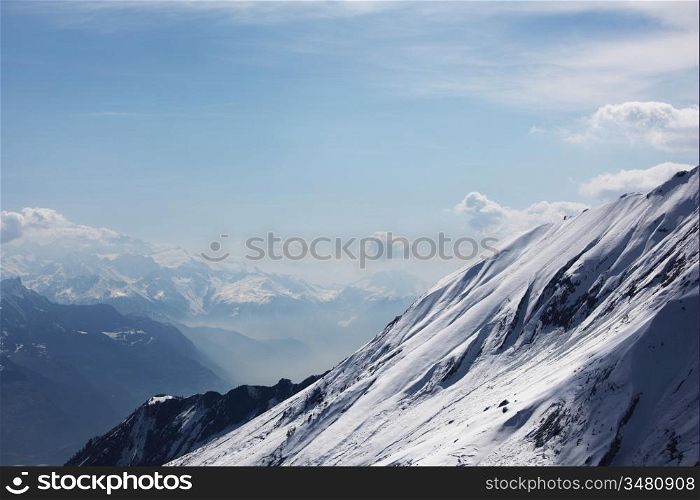 top of mountains in blue sky
