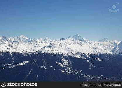 top of mountains in blue sky