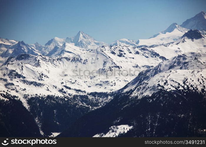 top of mountains in blue sky