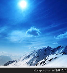 top of mountains in blue sky