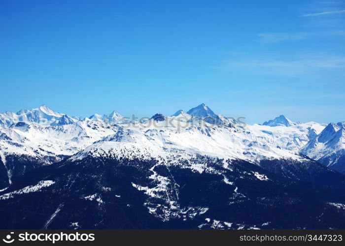 top of mountains sun in blue sky