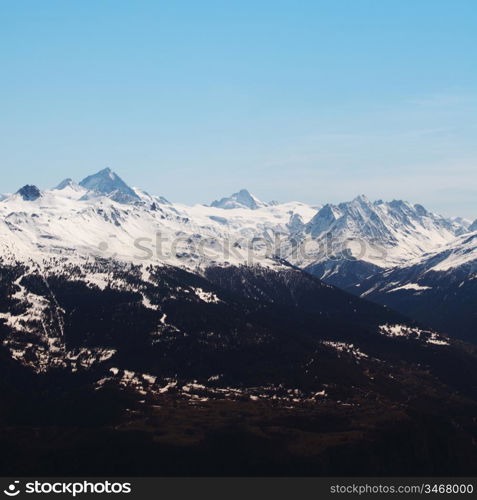 top of mountains sun in blue sky