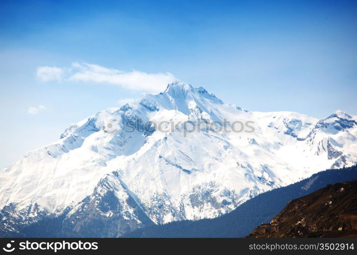 top of mountains sun in blue sky