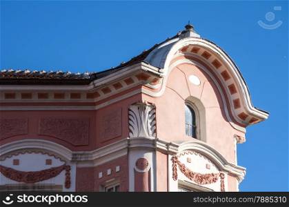 Top of old European retro house on blue sky background