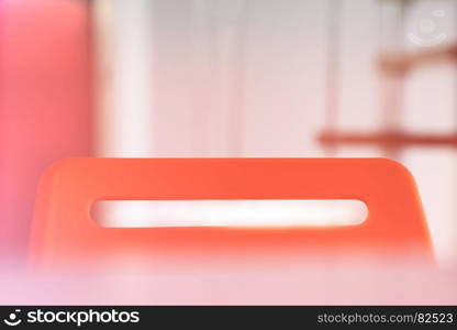 Top of the red office chair with light leak background. Top of the red office chair with light leak background hd