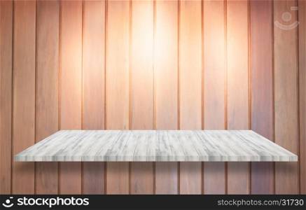 Top of white wooden shelf with spot light on wooden wall background, stock photo