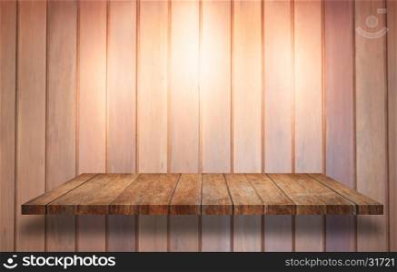 Top of wooden shelf with spot light on wooden wall background, stock photo