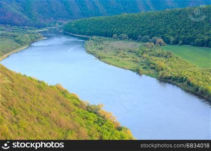 Top picturesque spring view of the Dnister river bend canyon, with spring fields on coast. Ternopil region, Ukraine, Europe.