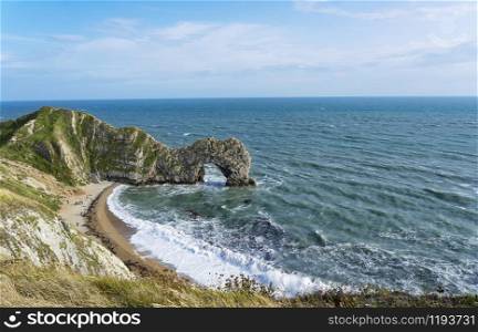 Top sea view of Durdle Door a part of the Jurassic Coast, Dorset in UK, Beautiful sea scapes with turquoise sea colour, Panorama Seaside in England.