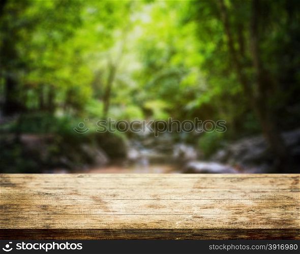 Top table wood and waterfall natural park background