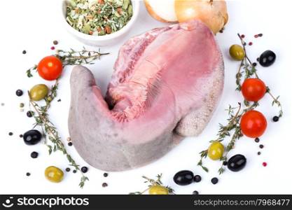 top uncooked raw tongue with serving spices on white background