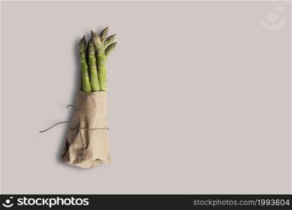 Top up up view fresh asparagus isolated on grey background. suitable for your design project.