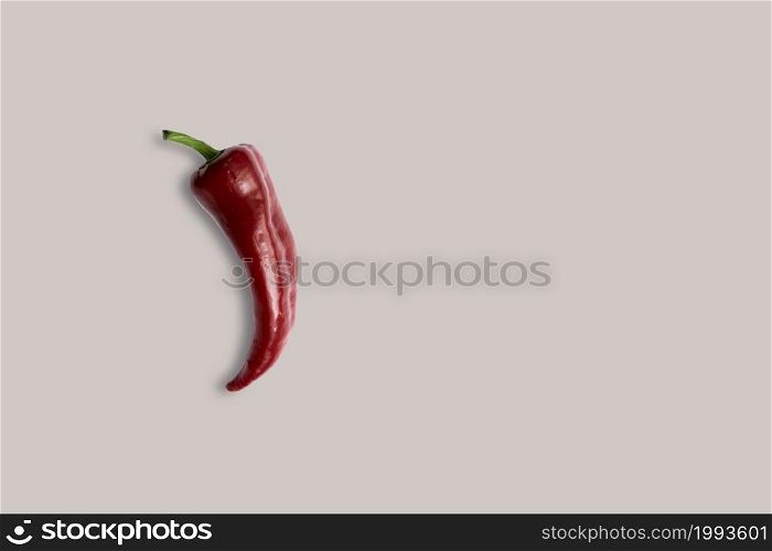 Top up up view fresh red chili isolated on grey background. suitable for your design project.