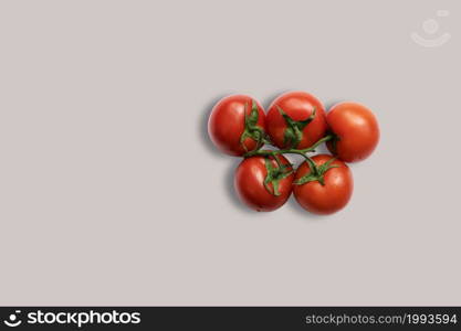 Top up up view red tomatoes isolated on grey background. suitable for your design project.