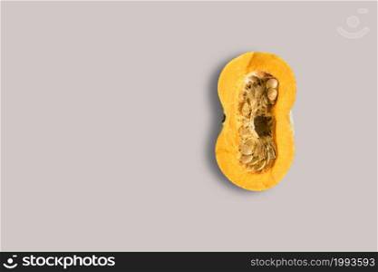 Top up up view yellow half pumpkin isolated on grey background. suitable for your design project.