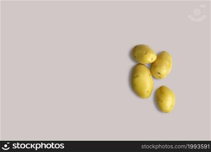 Top up up view yellow sweet potatoes isolated on grey background. suitable for your design project.