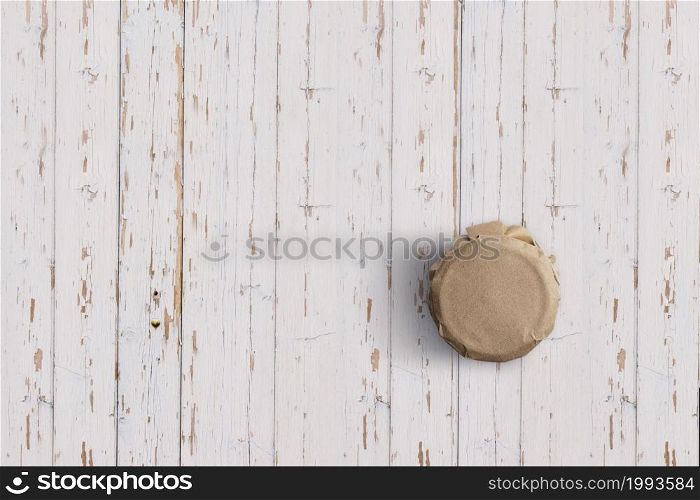 Top up up view yoghurt jar isolated on white wooden background. suitable for your design project.