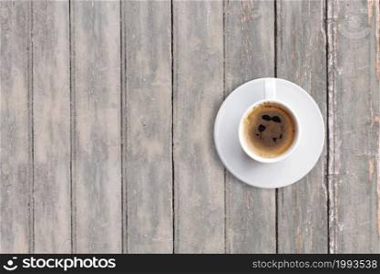 Top up view black espresso on dark wooden vintage table . added copy space for text , suitable for your food or drink concept background.