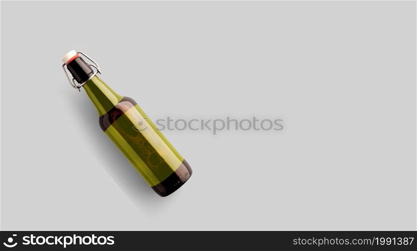 Top up view brown beer bottle with blank yellow template isolated on grey background. beer fiesta concept.