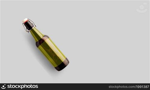 Top up view brown beer bottle with blank yellow template isolated on grey background. beer fiesta concept.