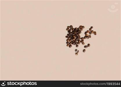 Top up view coffee beans roasted laying on white ground