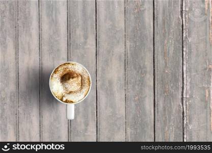 Top up view italian cappuccino on dark wooden vintage table . added copy space for text , suitable for your food or drink concept background.