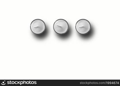 Top up view of three white candles on white background. fit for your design element.
