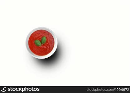 Top up view tomatoes ketchup on white bowl with two leaves . Top up view tomatoes ketchup on white bowl . fit for your design element.