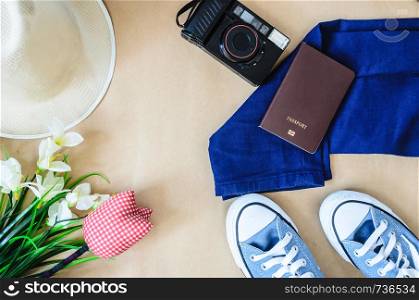 Top view Accessories for travel. Smartphone clothing, sneakers and a camera. , Travel concept