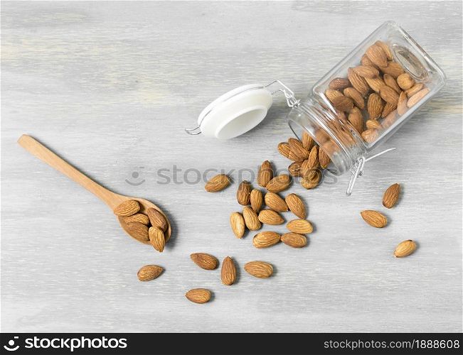 top view almonds jar with spoons. Resolution and high quality beautiful photo. top view almonds jar with spoons. High quality and resolution beautiful photo concept