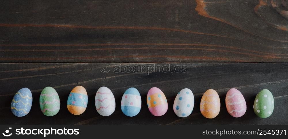 Top view and panorama of Easter eggs on rustic wood background with copy space