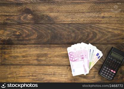 top view arrangement with banknotes pocket calculator