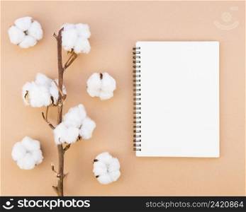 top view arrangement with cotton flowers notebook