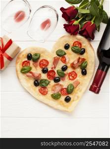 top view arrangement with heart shaped pizza