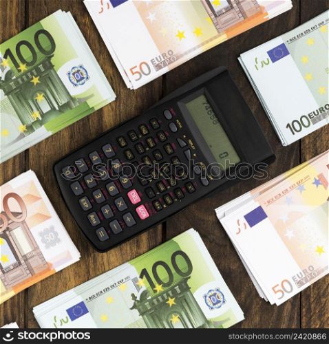 top view arrangement with money pocket calculator