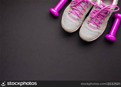 top view arrangement with pink shoes dumbbells