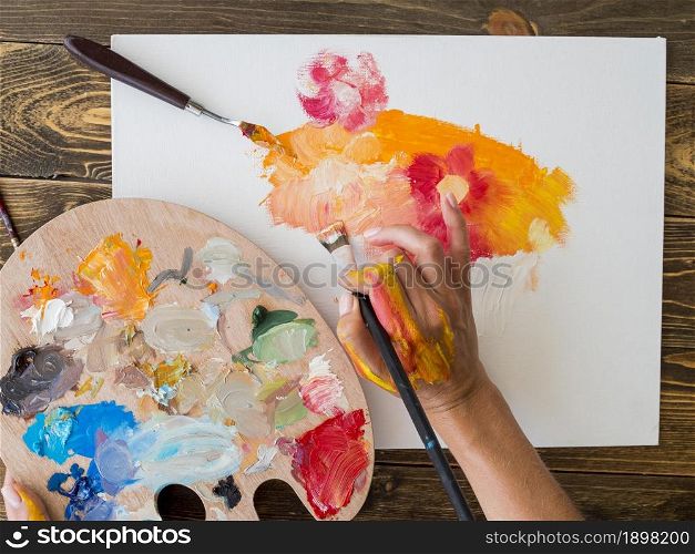 top view artist painting with brush palette. Resolution and high quality beautiful photo. top view artist painting with brush palette. High quality beautiful photo concept