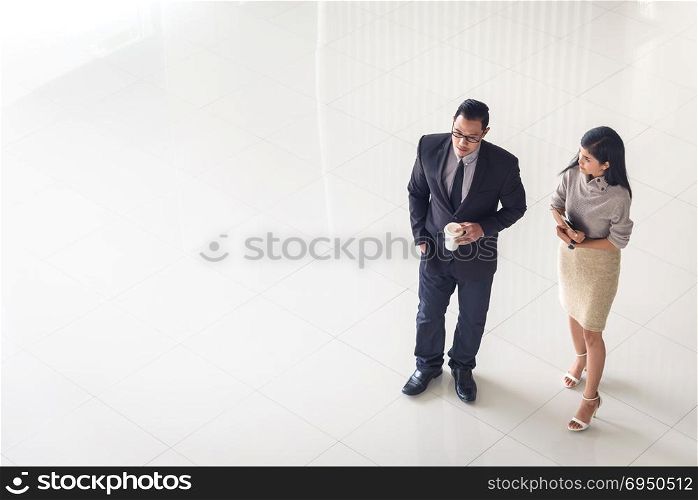 Top view, Asian business people, man and woman, talking about ideas, copy space