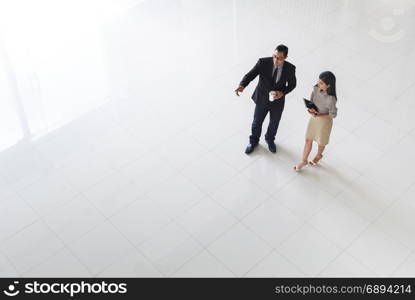 Top view, Asian business people, man and woman, talking about ideas, copy space, selective focus